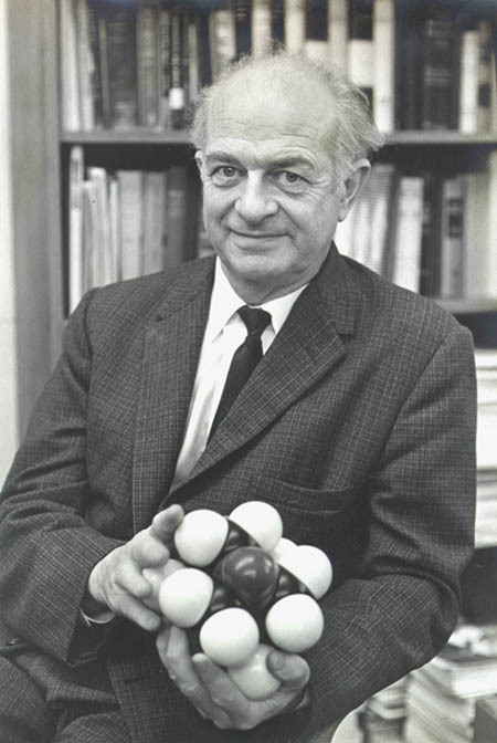 Photograph of Linus Pauling with a molecular model.