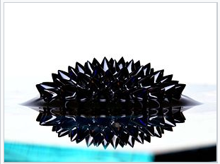A photograph of a ferrofluid in the field of a strong permanent magnet.